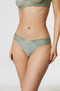 Side view of model wearing Azalea Green Voile Thong and balconette bra, displaying lightweight sheer voile fabric and low-rise silhouette.