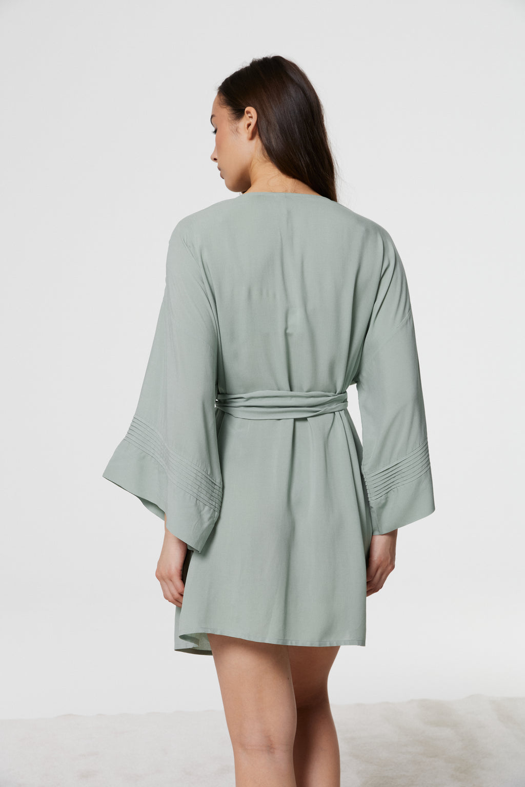 Back view of model in Azalea Green Voile Kimono Robe, showcasing wide flowing sleeves and self-tie waist detail in airy voile fabric