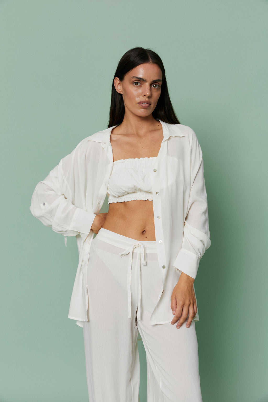 Full-length front view of model in Azalea White Voile Shirt layered over crop top and pants, showcasing fluid drape and effortless loungewear elegance.