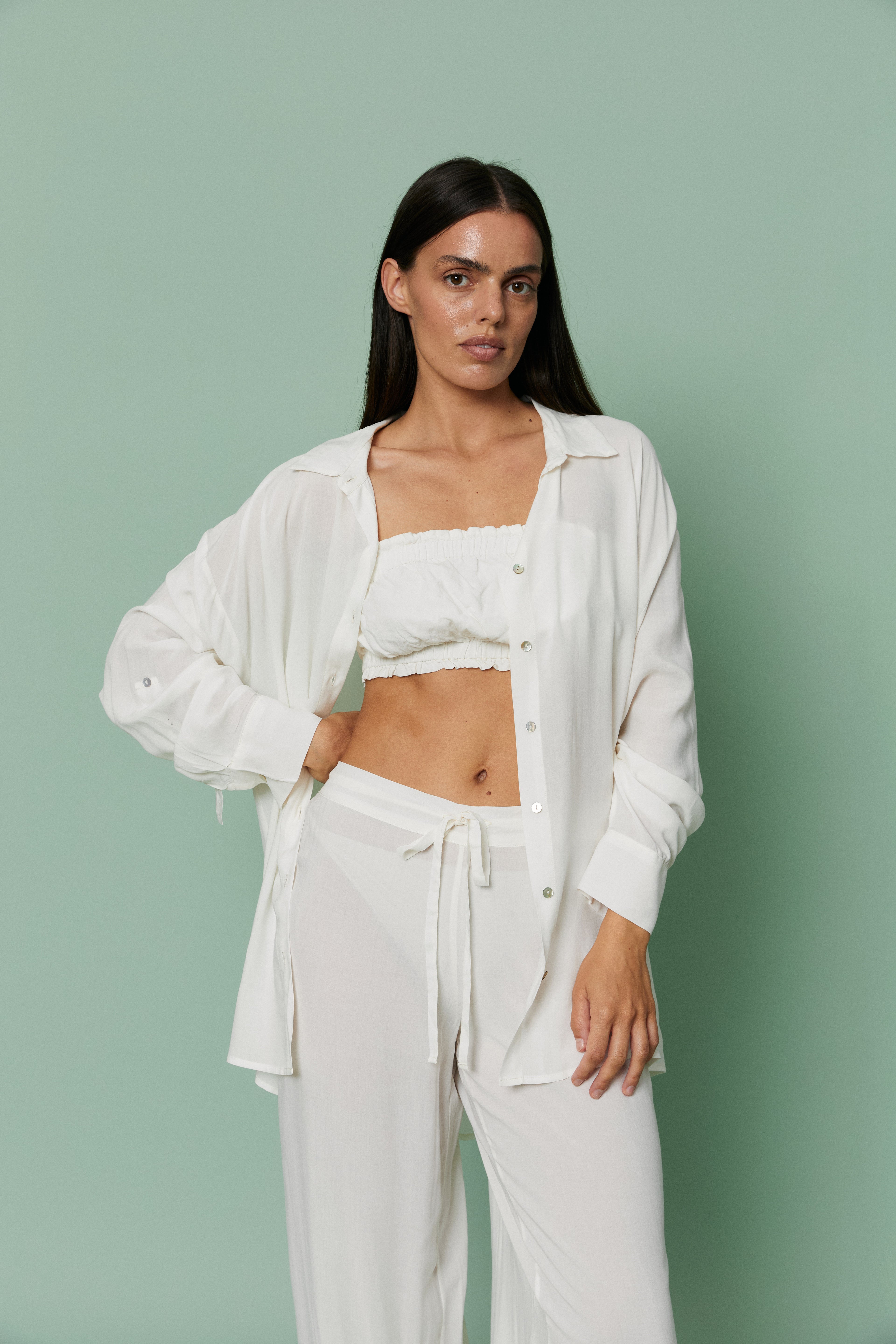 Full-length front view of model in Azalea White Voile Shirt layered over crop top and pants, showcasing fluid drape and effortless loungewear elegance.